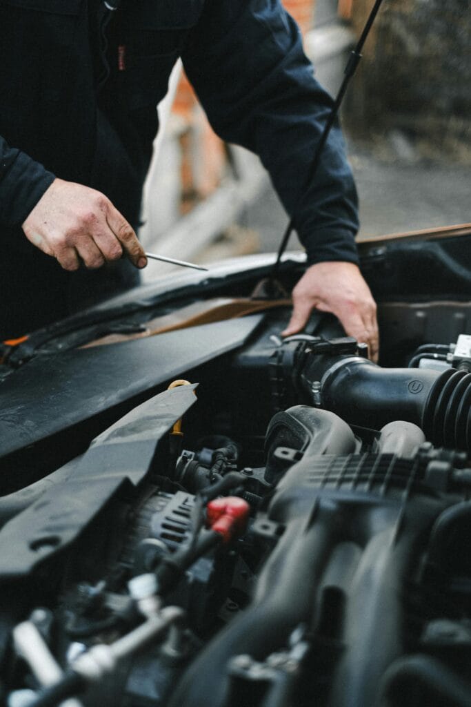 Close-up of a car engine showing components related to check engine light issues.
