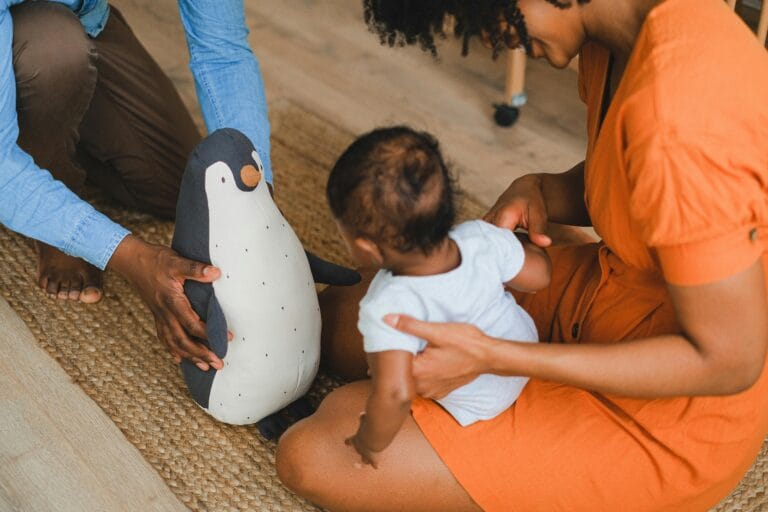 Babysitter caring for a baby at home
